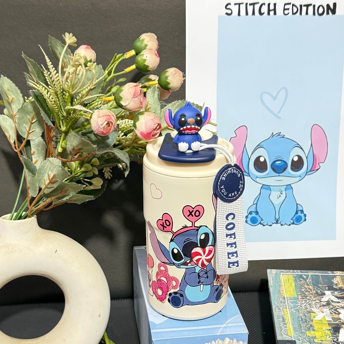 Nestush 450ml insulated kids tumbler featuring a cute blue character with candy and heart artwork, character topper and carry strap