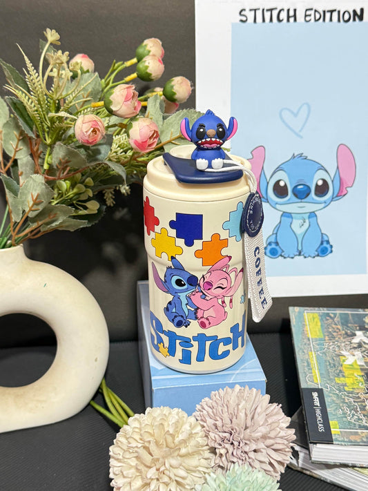 Nestush 450ml insulated kids tumbler with blue character topper, colorful puzzle-piece artwork and easy-carry strap