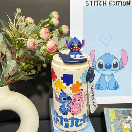 Nestush 450ml insulated kids tumbler with blue character topper, colorful puzzle-piece artwork and easy-carry strap