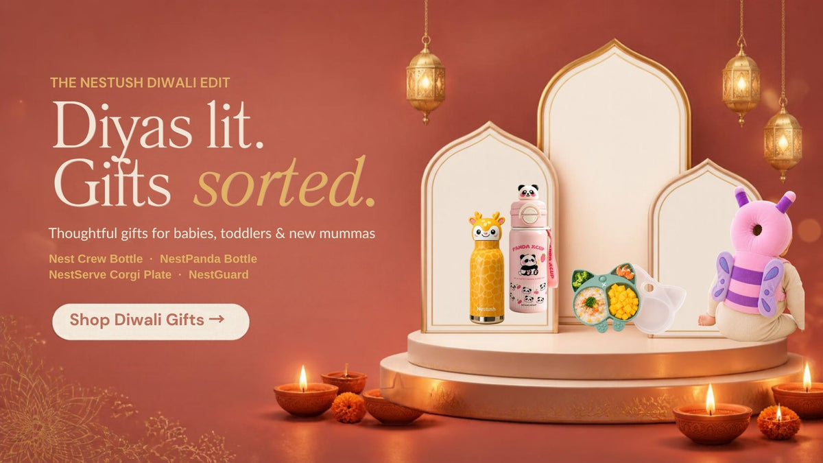 Nestush Diwali gift edit – Nest Crew giraffe bottle, NestPanda bottle, NestServe corgi plate and NestGuard on a festive stage with diyas