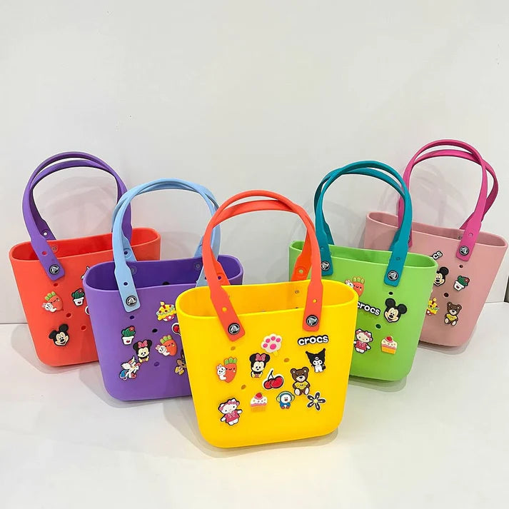 Close-up of NestVibe bag charms — original interchangeable designs