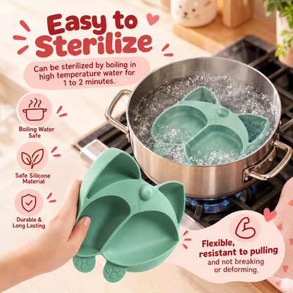 Nestush Corgi silicone baby plate being sterilised in boiling water on a stove