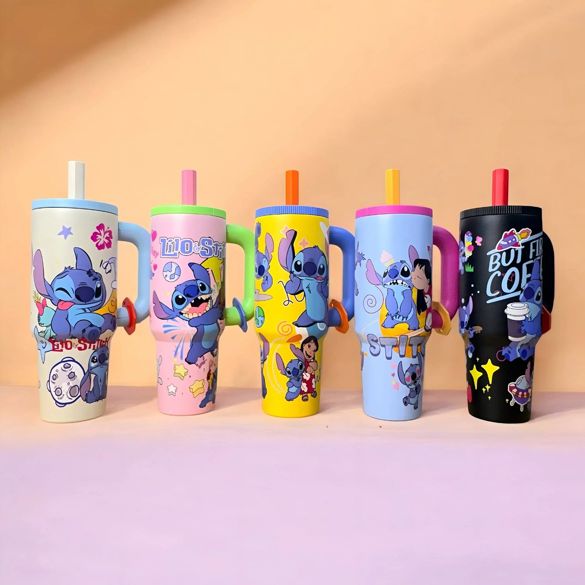 Five Stitch stainless steel tumblers displayed together with reusable straws and leak-resistant lids