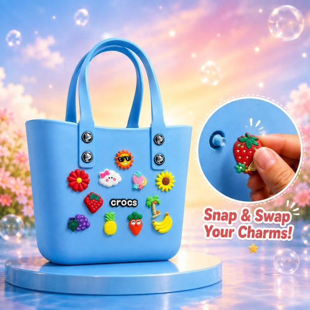 NestVibe silicone jelly crocs tote bag in sky blue with original sunflower, cloud, strawberry, and palm tree charms on a glossy display pedestal