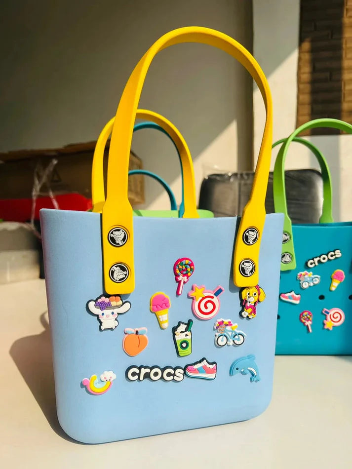 NestVibe silicone tote bag showing handles and charm attachment detail