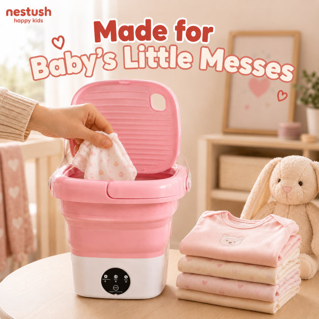 NestWash washing machine placed in a cozy nursery setting next to baby clothes, made for baby's little messes