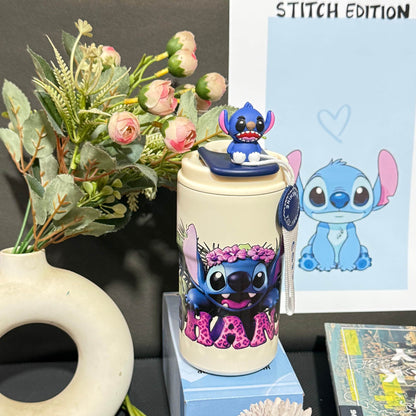 Nestush 450ml insulated kids tumbler featuring a blue character with pink tropical flowers, character topper and carry strap